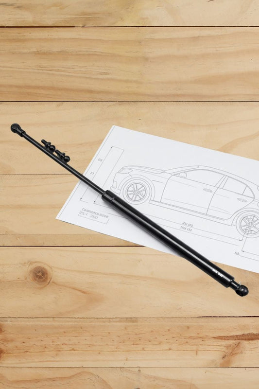 ITs a photography with a pick of car and one gassprings over a desk